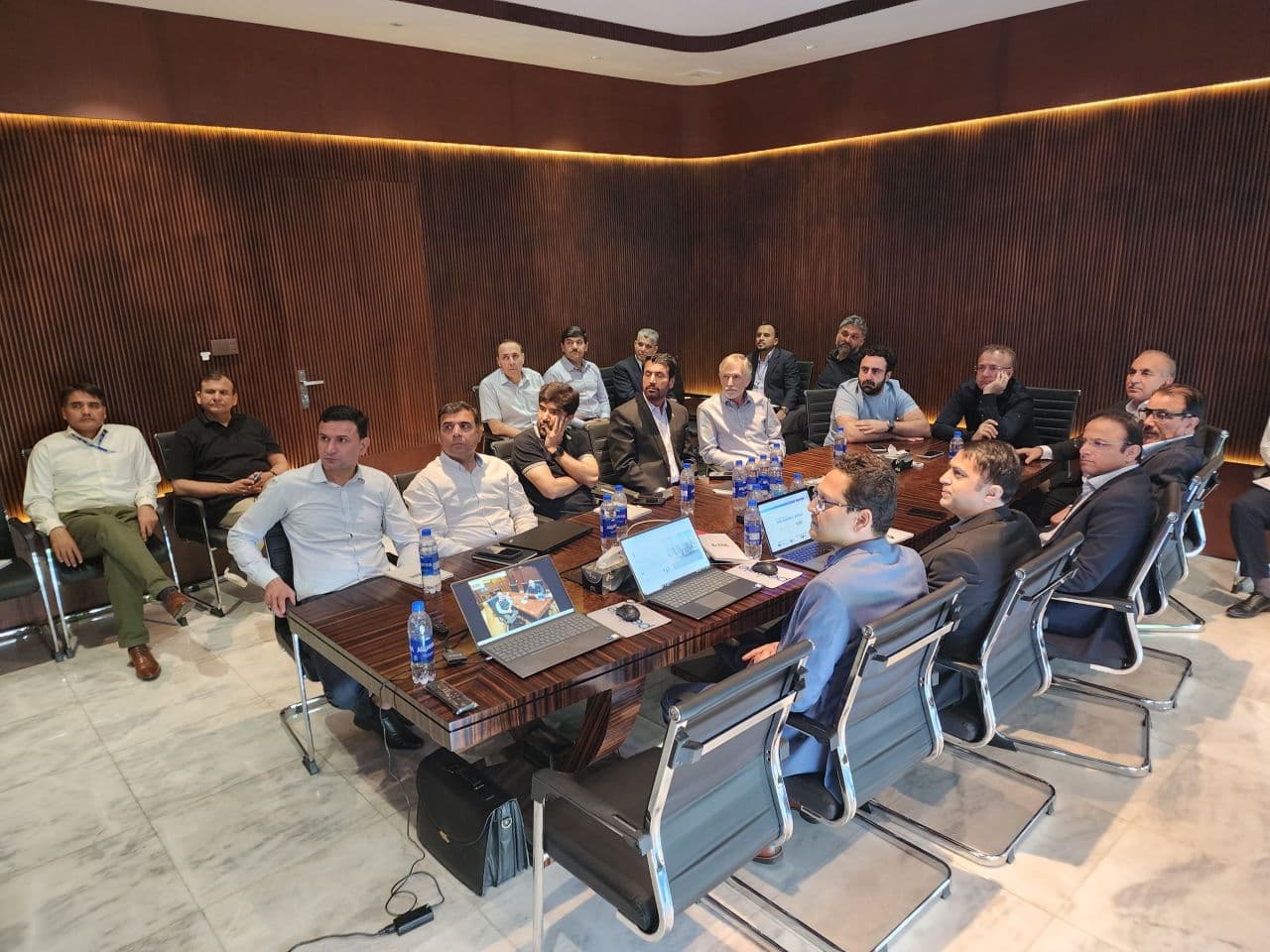 ZRK Group team seated around a boardroom table during a presentation session